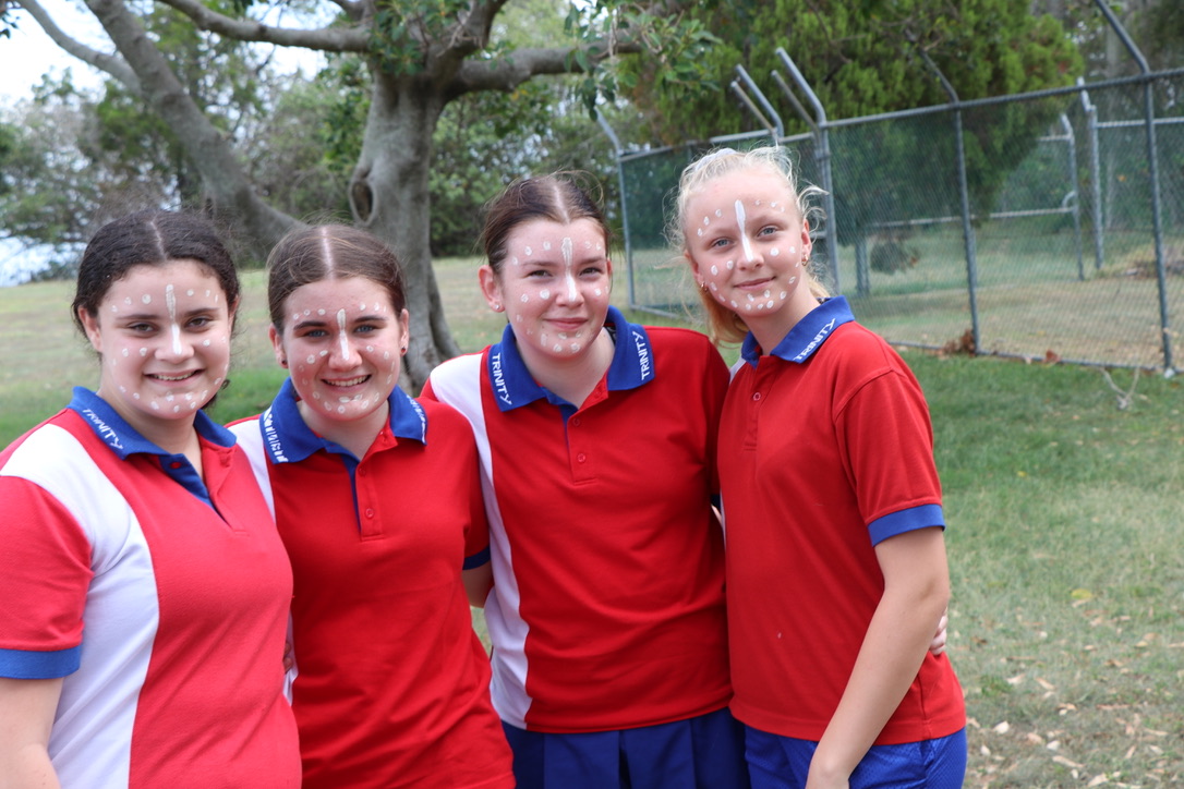 Students standing together with face paint during a cultural activity promoting inclusion shared experiences and connection to culture
